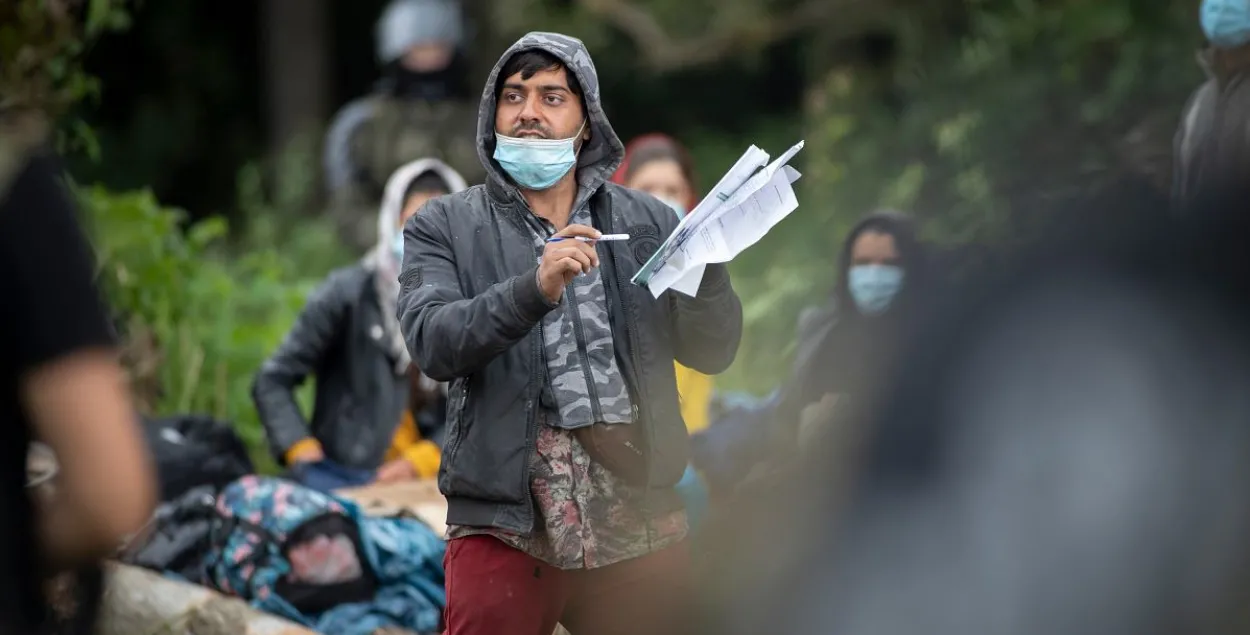 Мігрант на польска-беларускай мяжы ў 2021 годзе
