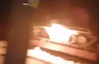 Кадр с горящим танком​