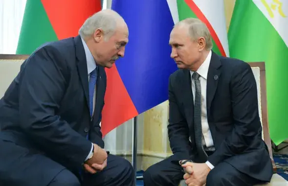 Alyaksandr Lukashenka and Vladimir Putin/ Reuters