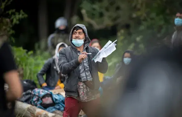 Мігрант на польска-беларускай мяжы ў 2021 годзе
